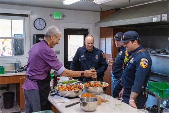 Napa County Fire working with Farmer Peter Jacobson to make tomato salads.