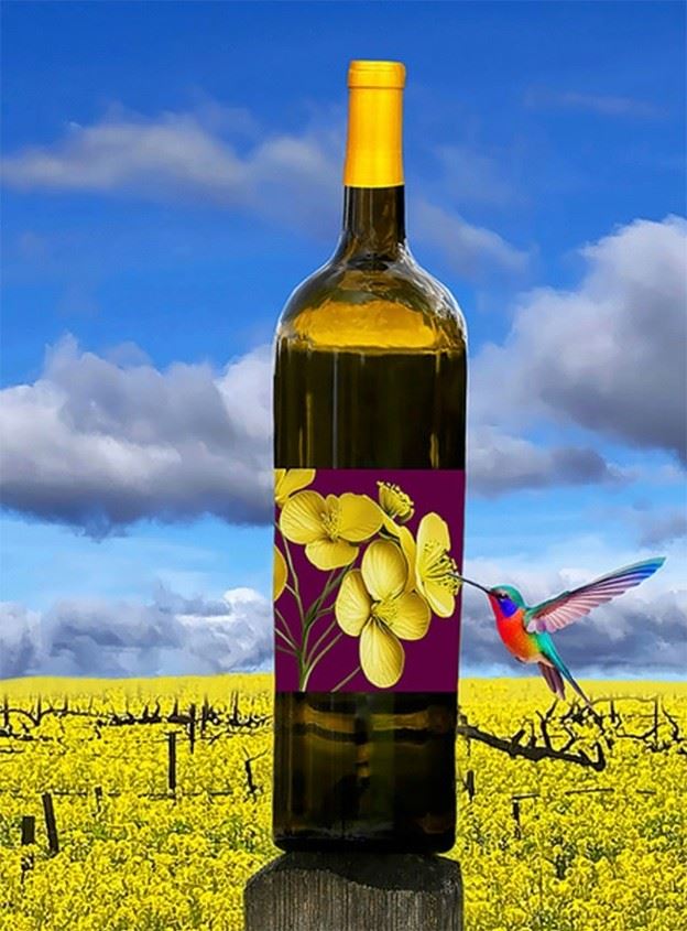 A wine bottle displayed in a vineyard with bright yellow flowers and a small hummingbird nearby.